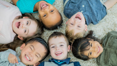 Kids laughing in a circle