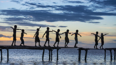Papuan children in sunset