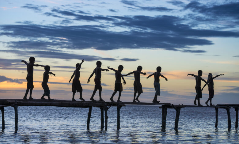 Papuan children in sunset