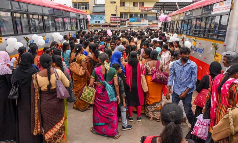 Women waiting for busses in Karnakta India