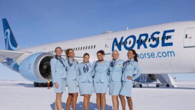 Norse cargo plane crew poses in front of airplane
