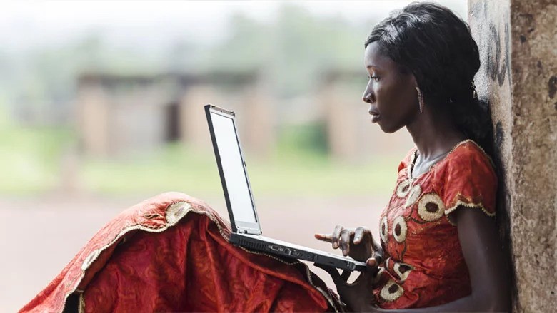 African woman with laptop on her knees