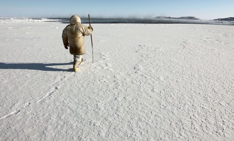 Inuit hunter checking the ice