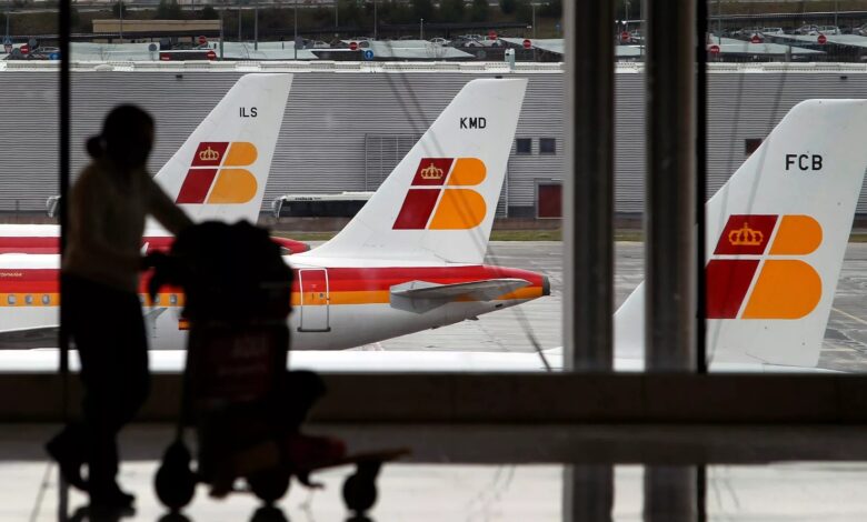 Iberia airline wings seen through airport window