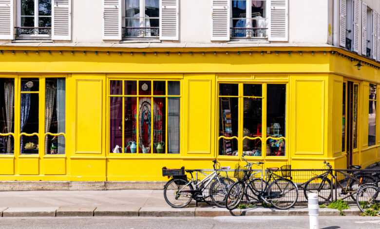 Yellow building facade and bikes in Paris, France