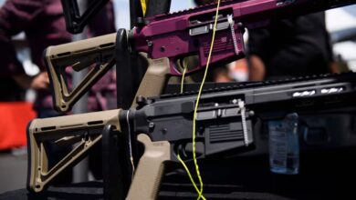 AR-15 style rifles are displayed for sale at a gun show in Costa Mesa, California, in 2021