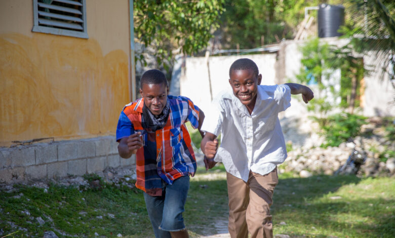Teenage Jamaican boys running