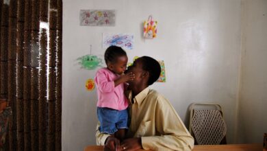 Edwin Motse, an HIV-positive Aids activist in Botswana with his daughter Ompi