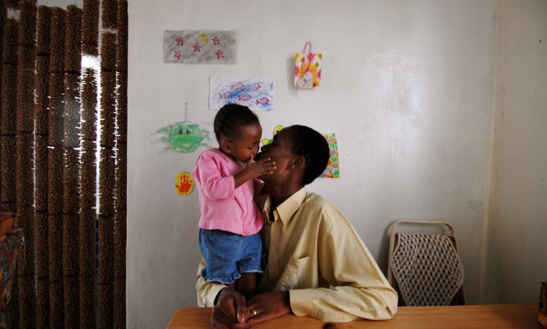 Edwin Motse, an HIV-positive Aids activist in Botswana with his daughter Ompi