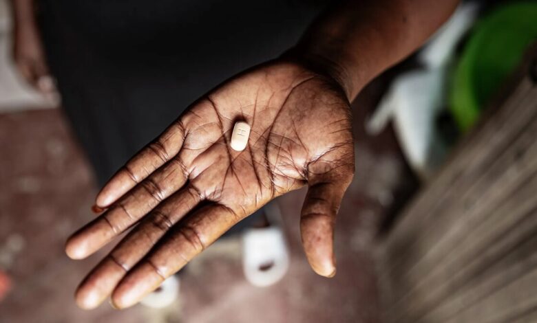 An ARV tablet being held in Kisumu, Kenya