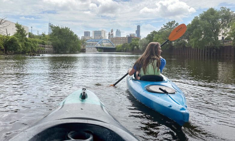 Krystyna Kurth paddles toward downtown on the Chicago River