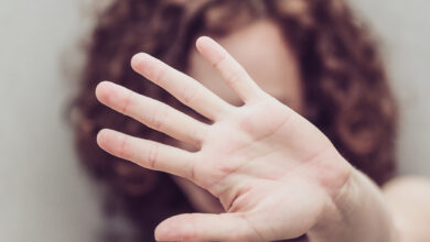 Woman makes stop gestures