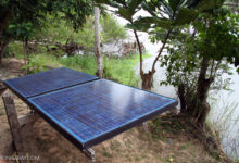 Solar panels installed in a forested area in Gabon