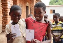 Girls in Mozambique with vaccination pass