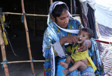 Pakistani mother is playing and expressing affection to her
