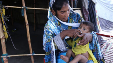 Pakistani mother is playing and expressing affection to her