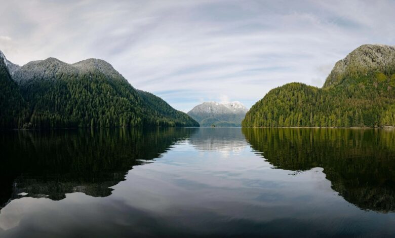 Snow-kissed mountains plunge into the sea along a dramatic fjord west of Bella Coola on British Columbia’s remote central coast