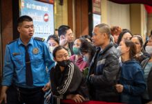 People crowd round to sell gold, Hanoi, Vietnam