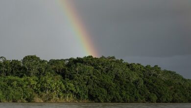 Rainbows cross the Putumayo River on the outskirts of Puerto Asis, Colombia