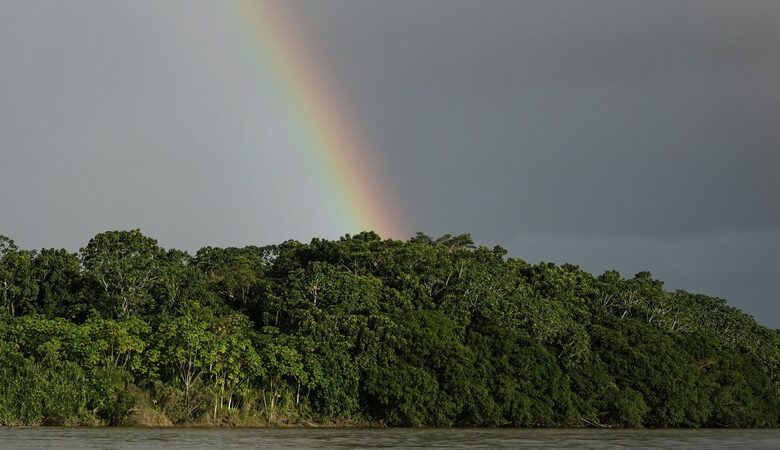 Rainbows cross the Putumayo River on the outskirts of Puerto Asis, Colombia