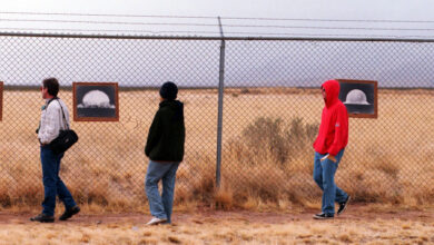 F366942 08: Tourists look at photographs of the first nuclear bomb test at the Trinity Site where the bomb was tested at 5:29:45 a.m. Mountain War Time on July 16, 1945 on the White Sands Missile Range, New Mexico, April 1, 2000. The 19 kiloton explosion not only led to a quick end to the war in the Pacific but also ushered the world into the atomic age.