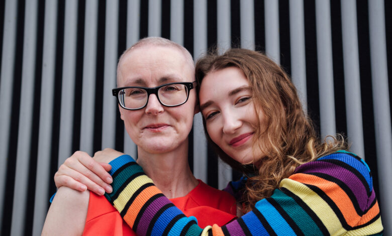 Portrait woman with cancer hugging her daughter