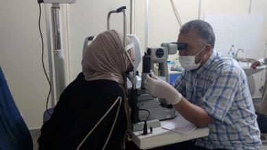 a healthcare worker is doing an eye check, Libya