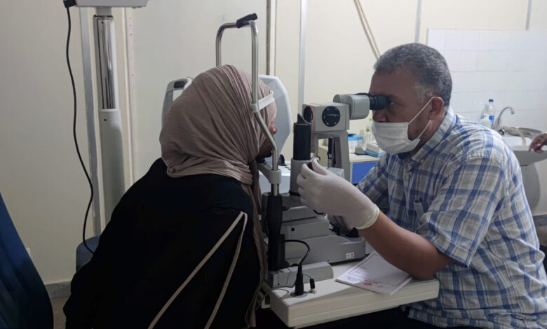 a healthcare worker is doing an eye check, Libya