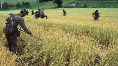 Soldiers from the Yugoslavian Federation Army check for land mines at the Slovenia/Croatia border