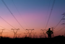Power lines, thinking and silhouette of person at sunset for electricity, circuit cables and voltage wires. Engineering, construction and technician for maintenance, infrastructure and installation
