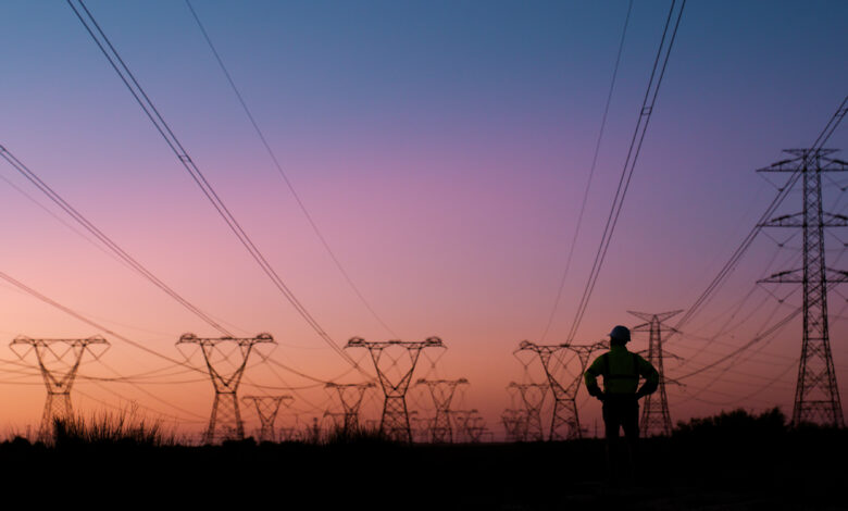 Power lines, thinking and silhouette of person at sunset for electricity, circuit cables and voltage wires. Engineering, construction and technician for maintenance, infrastructure and installation