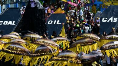 Activists perform the death of fossil fuels at the so-called Great People's march on the sidelines of the Cop30 in Belem