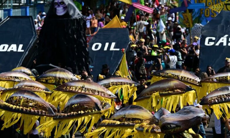 Activists perform the death of fossil fuels at the so-called Great People's march on the sidelines of the Cop30 in Belem