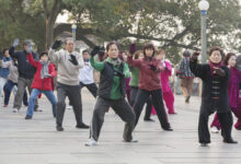 Senior citizens exercising in a public park