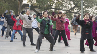 Senior citizens exercising in a public park