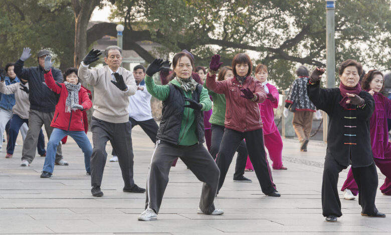 Senior citizens exercising in a public park