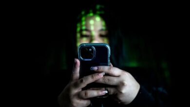 Woman checks smart phone