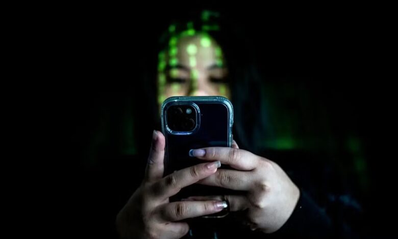 Woman checks smart phone