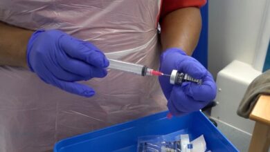 nurse prepares jab close up