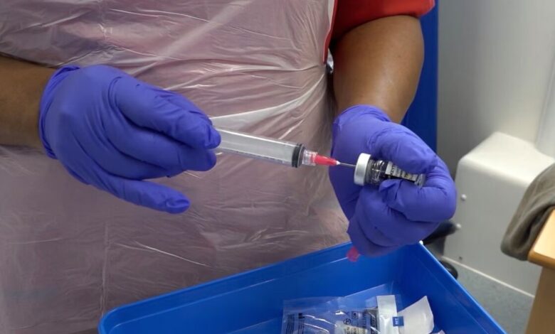 nurse prepares jab close up