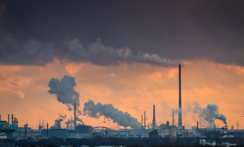 Dramatic sunset over industrial area