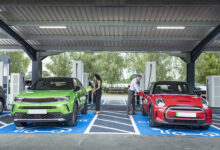 UK, York, People charging their electric cars at charging station