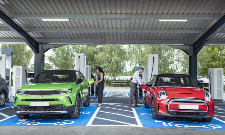 UK, York, People charging their electric cars at charging station