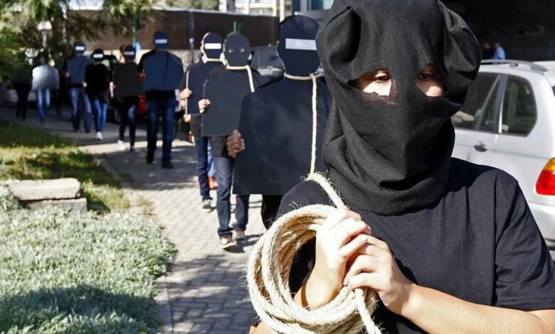 Protesters hold cardboard figures with ropes round their necks during a rally against the death penalty in Beirut, Lebanon in October 2013.