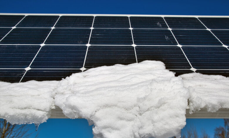 snow melting on solar panels in sunshine