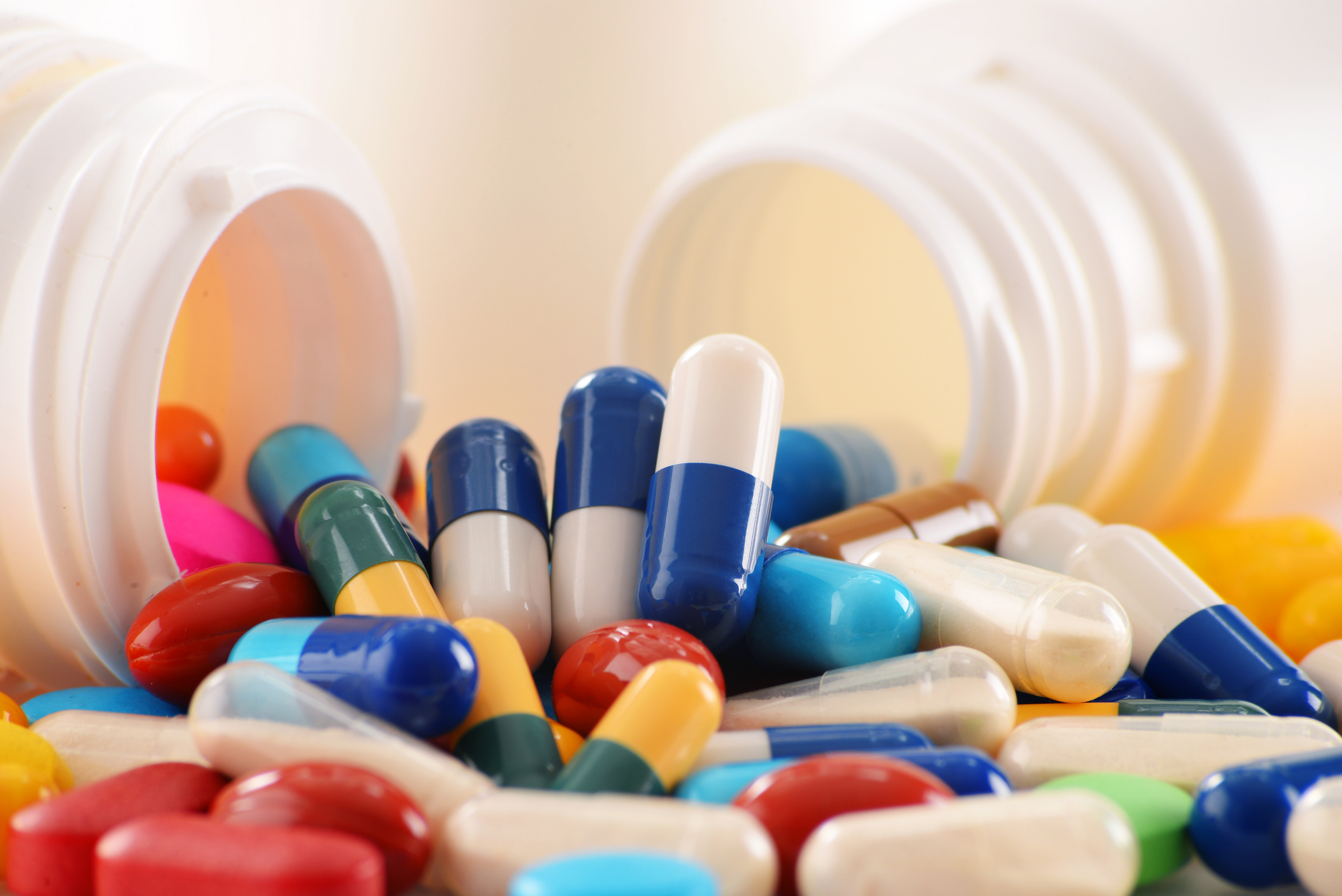 Composition with variety of drug pills and container