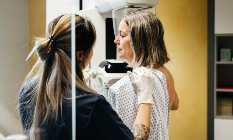 Nurse Assisting Patient During Mammogram