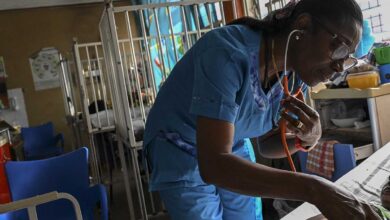 Dr. Mame Yaa Nyarko, director of the Accra Children's Hospital, examines a young patient.