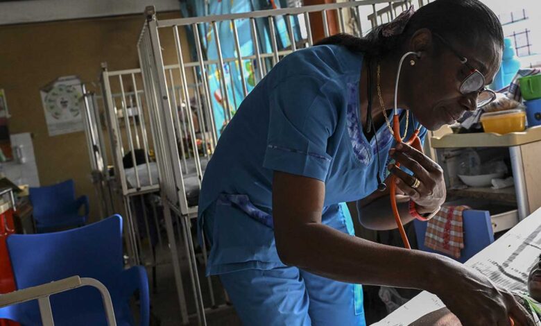 Dr. Mame Yaa Nyarko, director of the Accra Children's Hospital, examines a young patient.