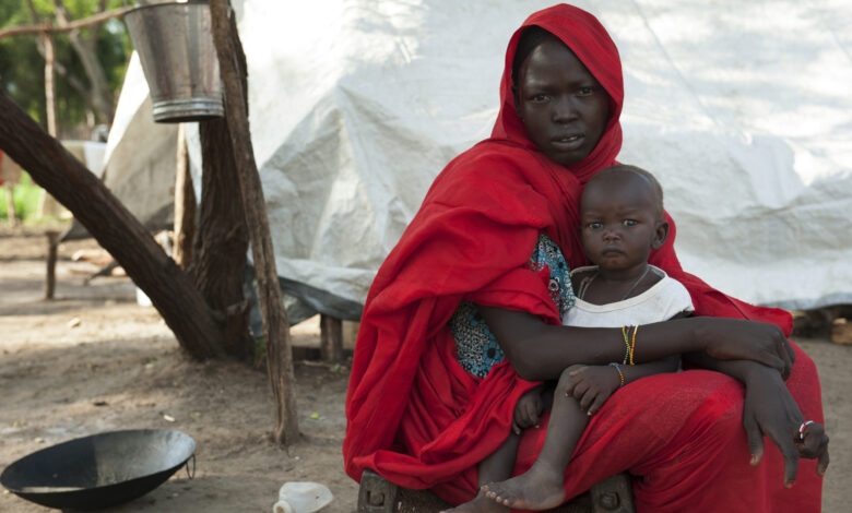 A woman holds her child in a refugee camp in South Sudan.